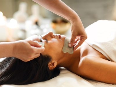 Face gua sha massage or beauty treatment in spa salon